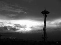 sun and clouds behind Space Needle